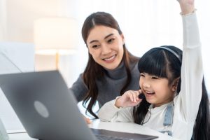 mother and daughter learning online